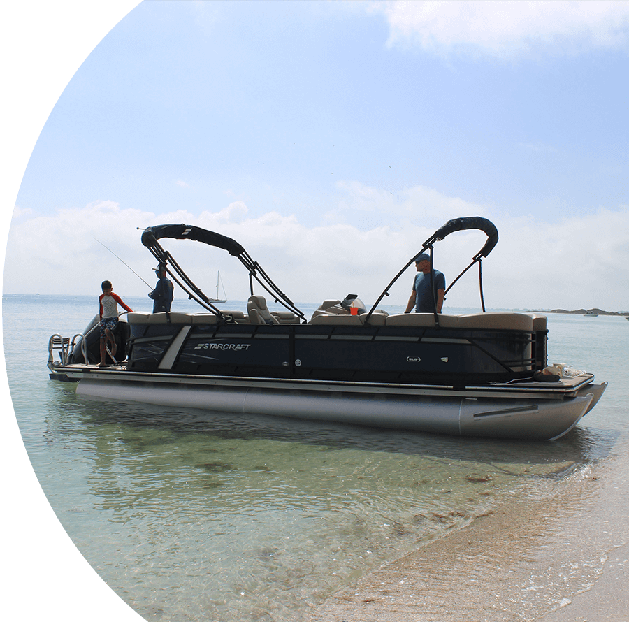 A boat with two people in it is out on the water.